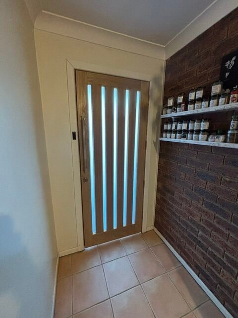 Installed timber entry door