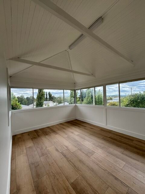 Enclosed verandah with finished timber flooring